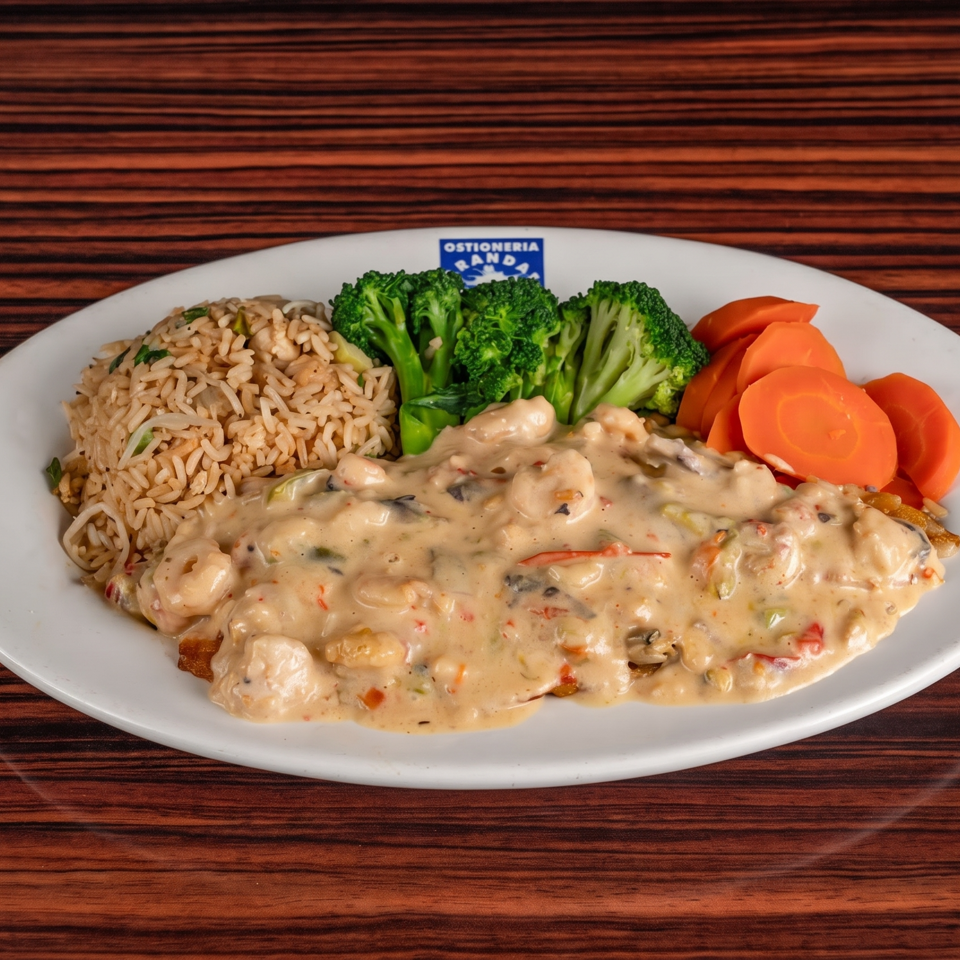 Seafood dish with creamy sauce, rice, broccoli, and carrots on a white plate.